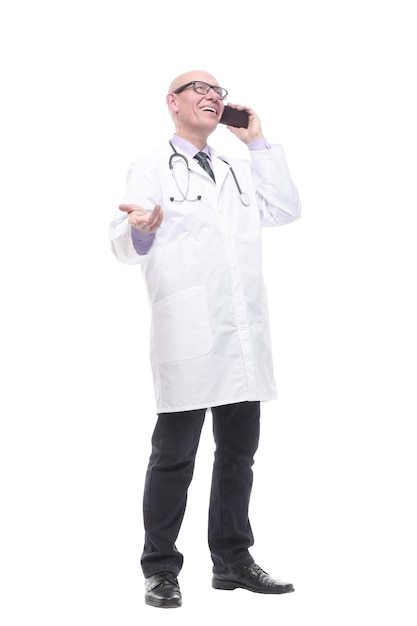 In full growth smiling doctor with a smartphone