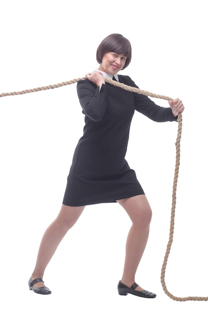 In full growth young business woman pulls a rope