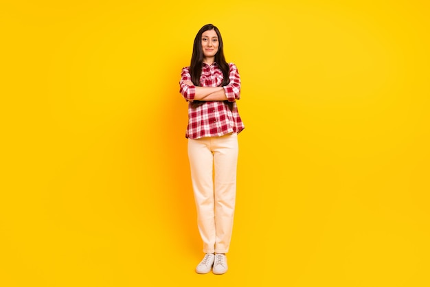 Full length body size photo of confident young business woman with crossed hands isolated on vivid color background