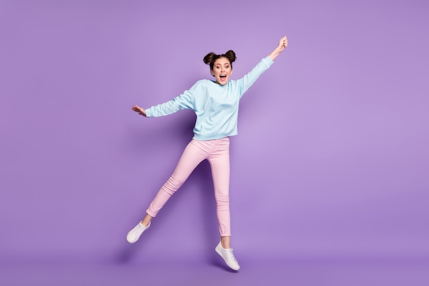 Full length body size view of her she nice attractive slim cheerful crazy girl jumping holding invisible parasol windy isolated on violet purple lilac bright vivid shine vibrant color background