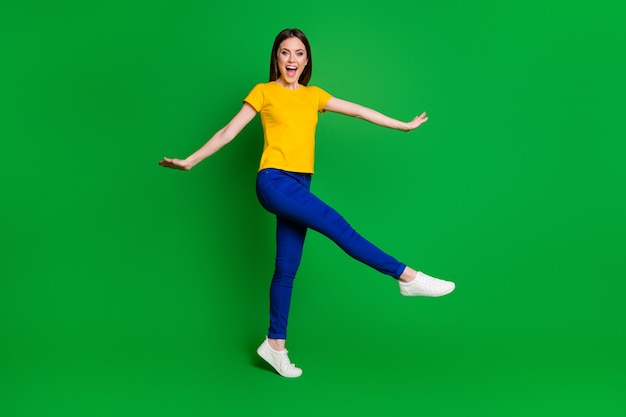 full length body size view portrait of cheerful girl jumping going