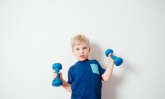 Photo full length of boy holding blue over white background