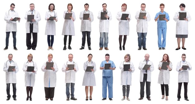 Full length group of doctors with notepad isolated