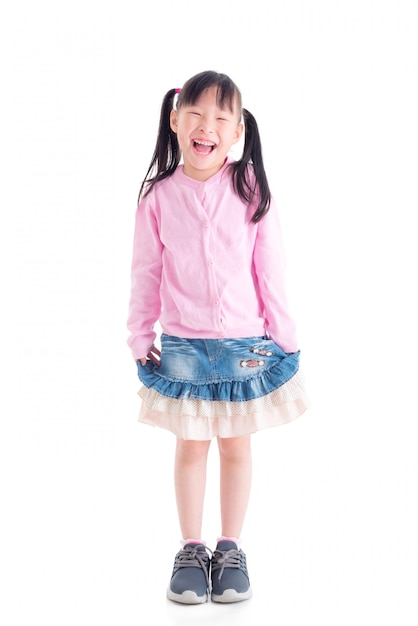 Full length of Happy little asian girl smiling over white space