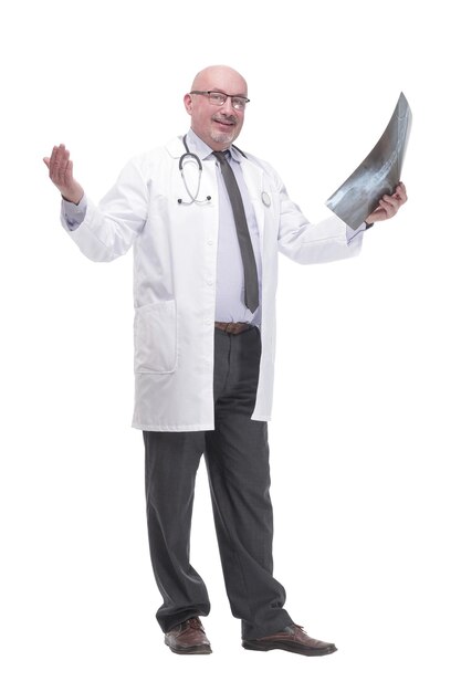 Full-length. mature doctor with x-ray .isolated on a white background.