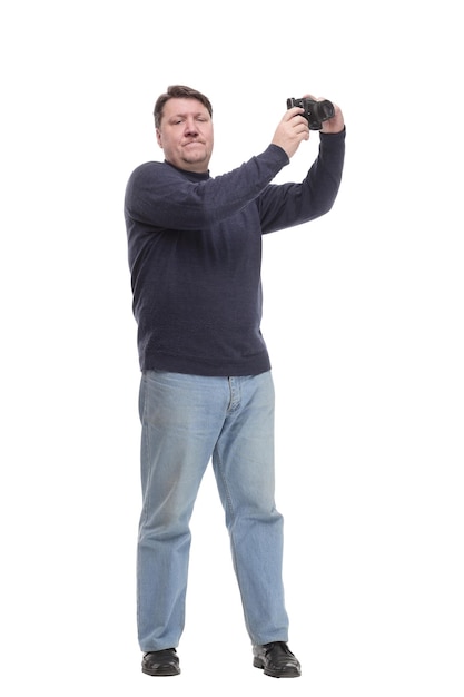 Full-length. mature man with a camera.isolated on a white background.