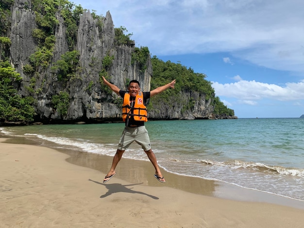 Full length of person on beach against sky