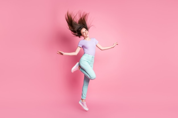 Full length photo of nice pretty lovely cute girl jump enjoy rest relax wear good look clothes gumshoes isolated over pink color background