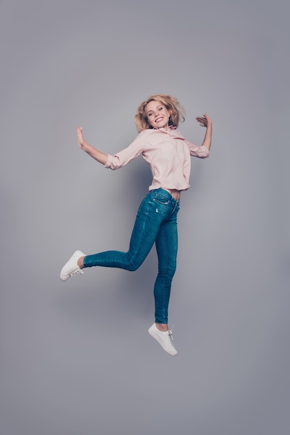 Full length portrait of attractive girl flying air excited isolated grey