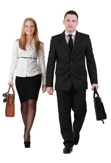 Photo full length portrait of businessman and businesswoman with bags walking against white background