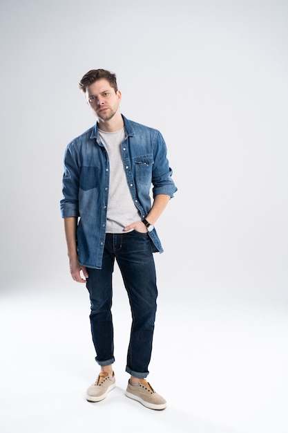 Full length portrait of a casual man standing.