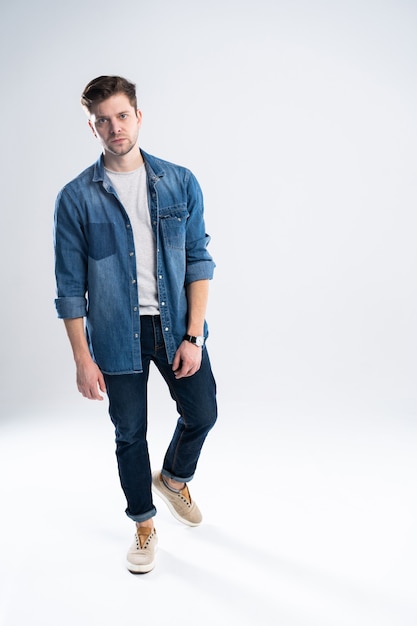 Full length portrait of a casual man standing.