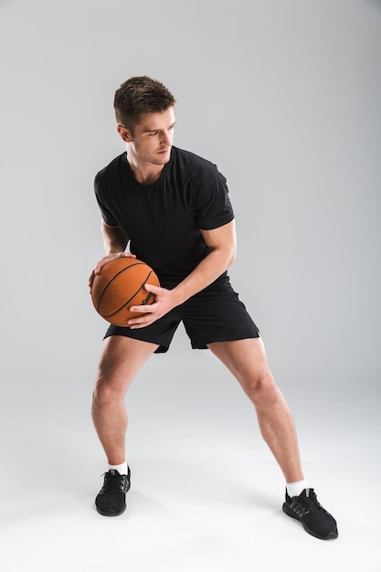 Full length portrait of a focused young man