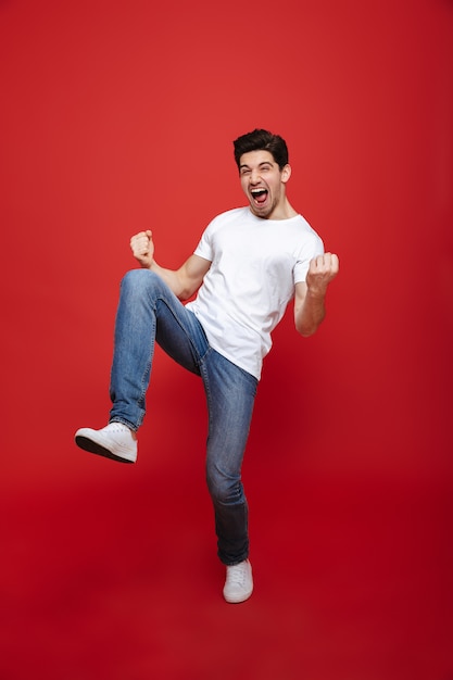 Full length portrait of a happy young man