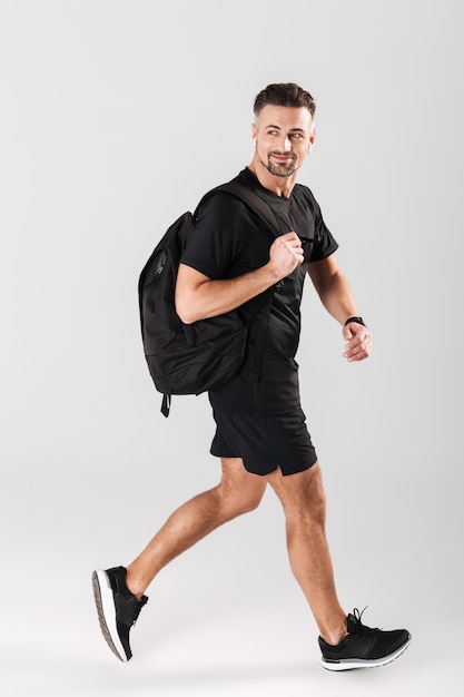 Full length portrait of a smiling mature sportsman