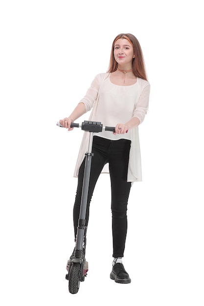 Full length portrait of a smiling woman riding a scooter