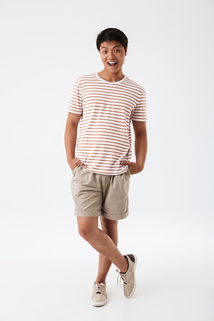 Full length portrait of a smiling young asian man