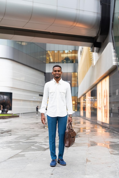 Full length shot of black man outdoors in city