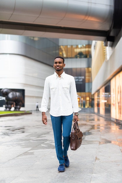 Full length shot of black man outdoors in city