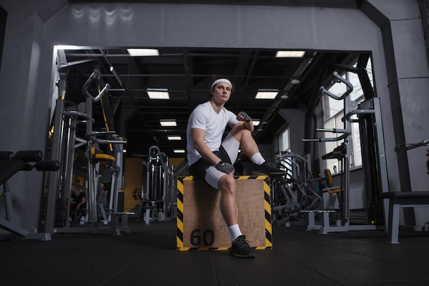 Full length shot of a handsome sportsman resting on a jumping box