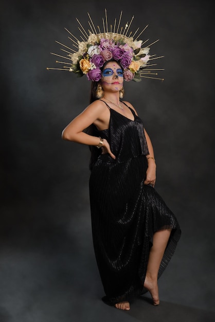 Full length studio portrait of a girl with catrina makeup