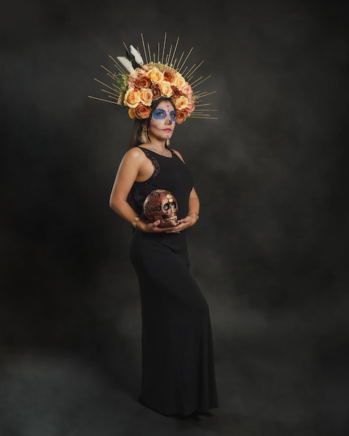 Full length studio portrait of a girl with catrina makeup