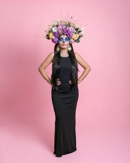 Full length studio portrait of a girl with catrina makeup