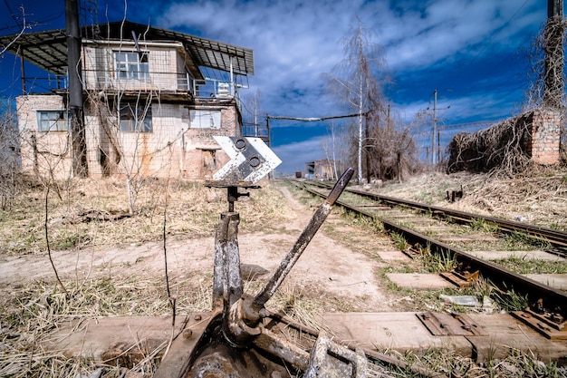 Full length view of the empty rails without people Blue sky Summer Abandoned railway station and transportation concept