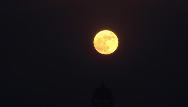 a full moon is rising in the night sky