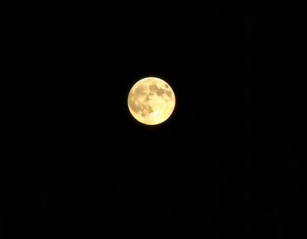 a full moon is seen in the dark sky