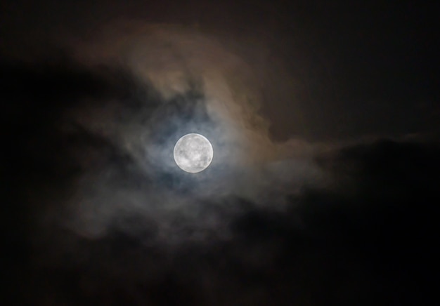 Full moon through the clouds on a cold winter morning!