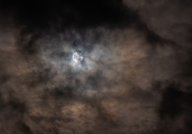 Full moon through the clouds on a cold winter morning!