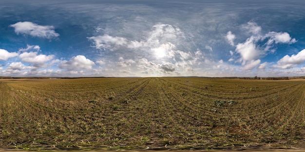 Full seamless spherical hdri panorama 360 degrees angle view on among fields in spring day with awesome clouds in equirectangular projection ready for VR AR virtual reality content