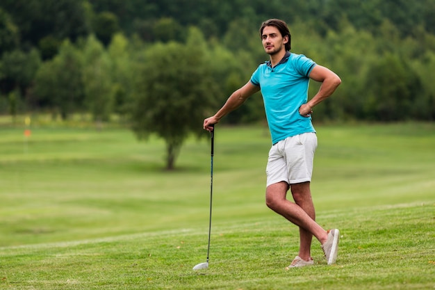 Full shot adult golfer in the nature