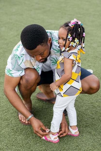 Full shot african family outdoors