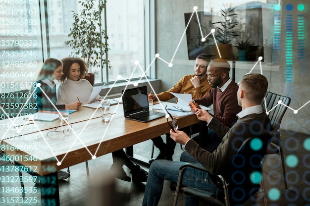 Full shot business people sitting at table