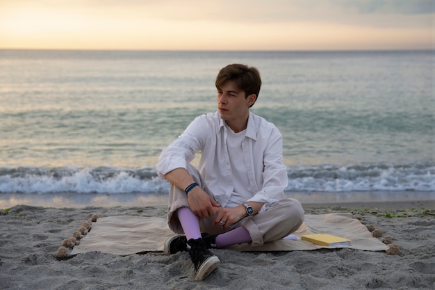 Full shot contemplative man at the seaside