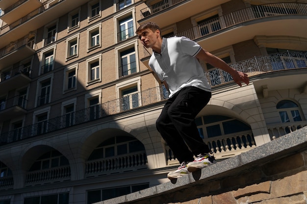 Full shot fit man doing parkour training