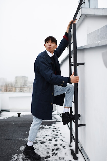 Full shot guy climbing ladder