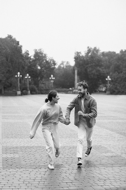 Full shot happy couple running