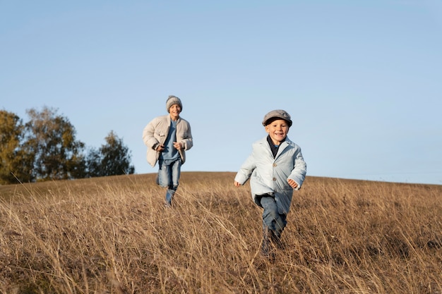 Full shot kids running on field