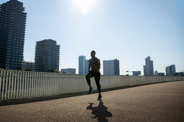 Photo full shot man running outdoors