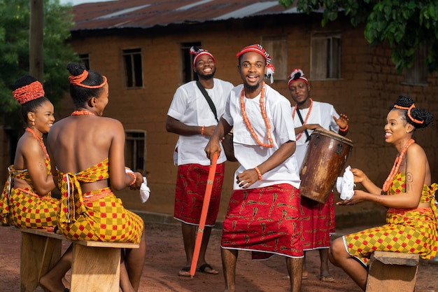 Full shot nigerian people celebrating outdoors