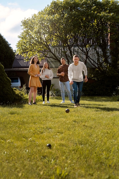 Full shot people playing sport outside