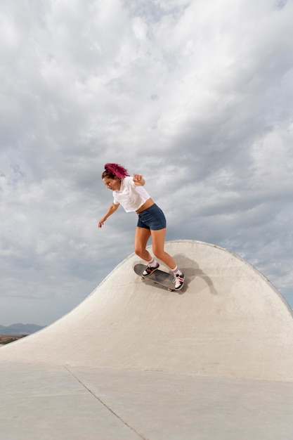 Full shot skater with board outdoors