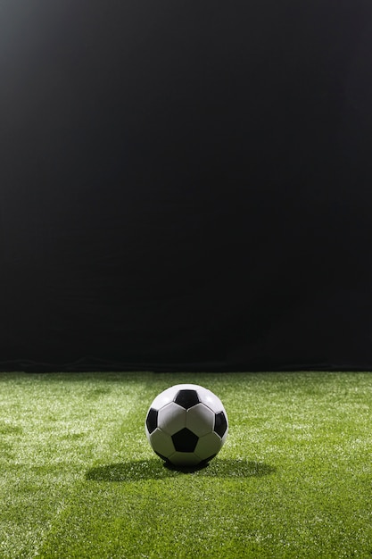 Full shot soccer ball on the pitch