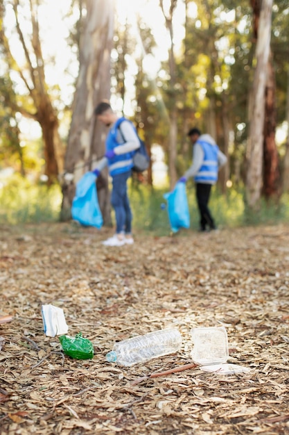 Full shot volunteers collecting garbage