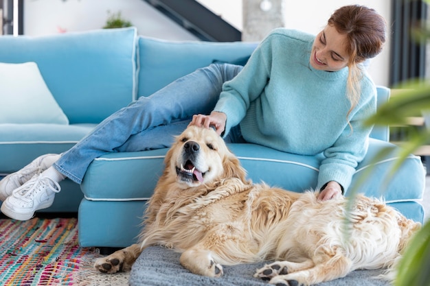 Full shot woman petting dog