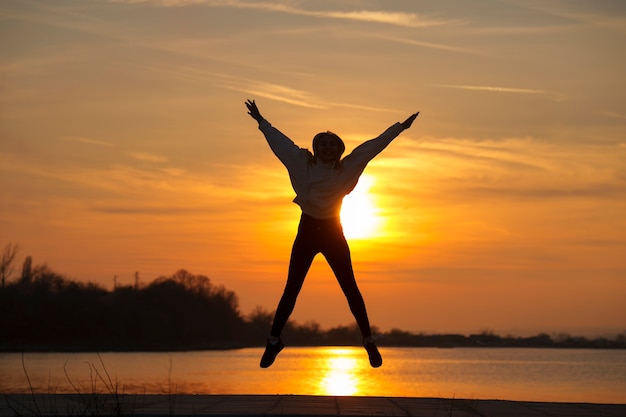 Full shot woman posing at sunset