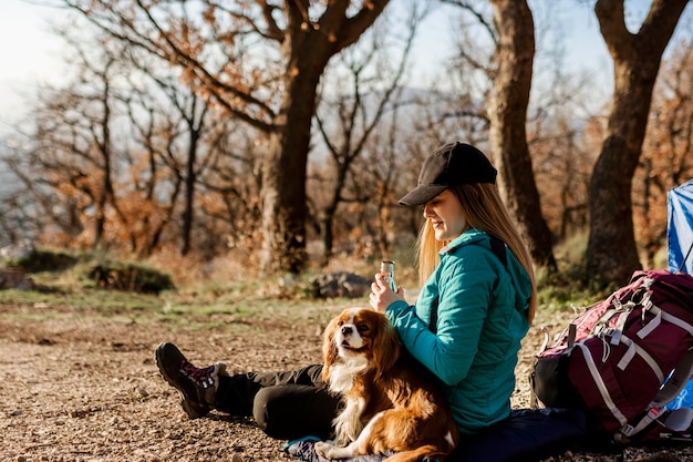 Full shot woman with dog outdoors